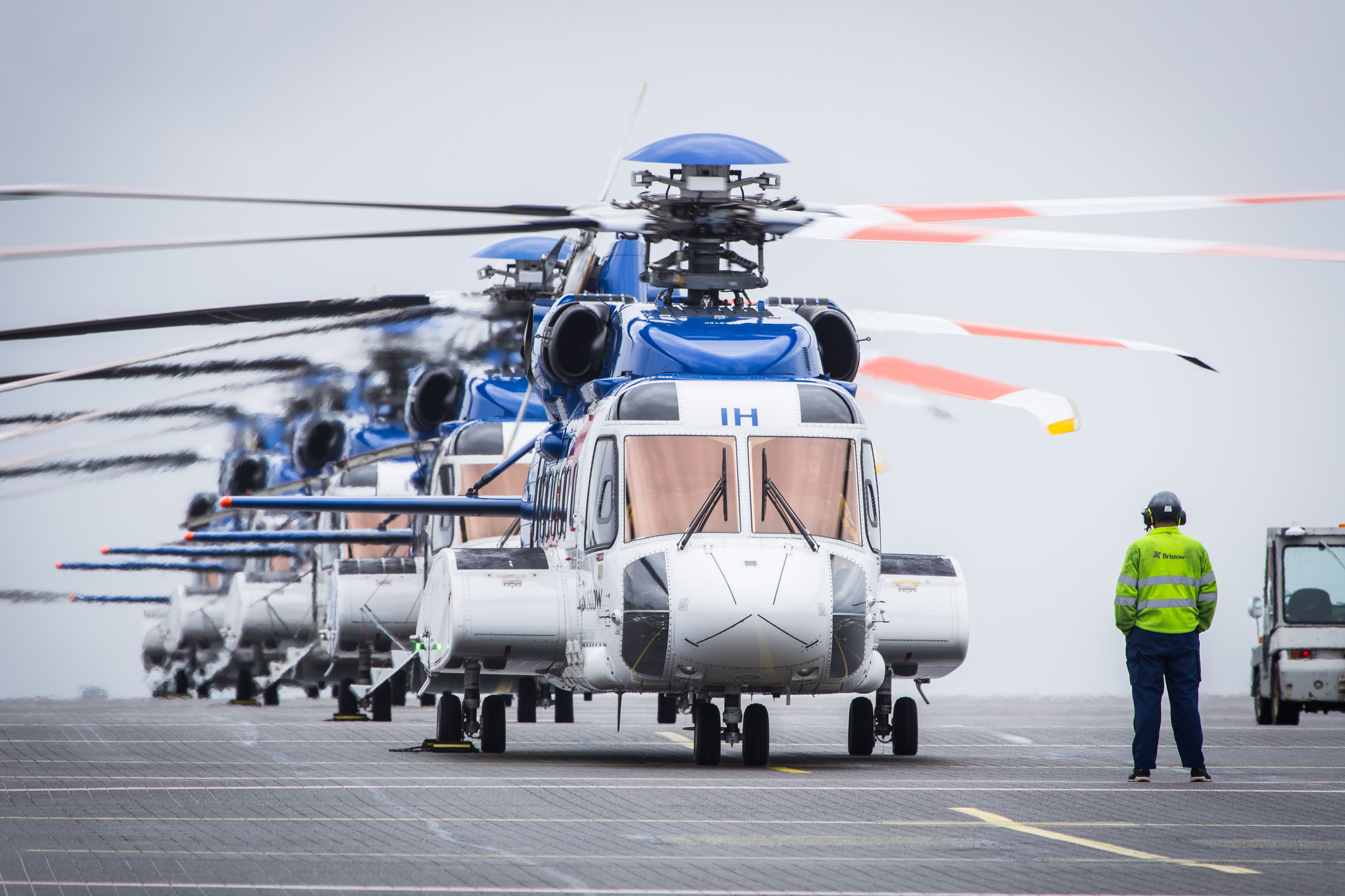 Helicopters lined up on an operational ramp